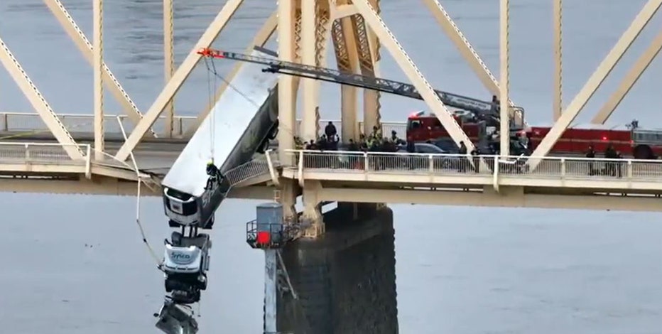 Louisville driver rescued from semi-truck hanging over Ohio River