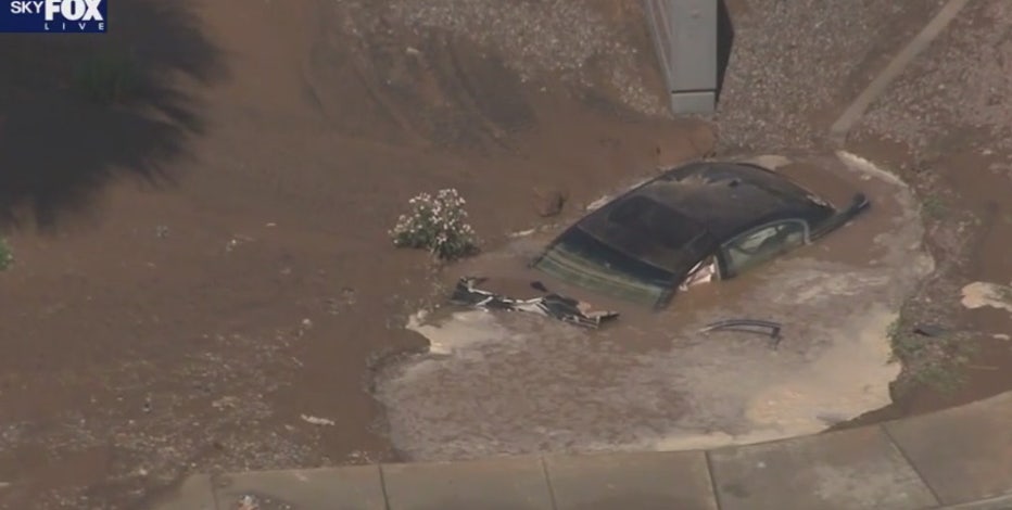 Car sinks into mud near Desert Sky Mall in Phoenix