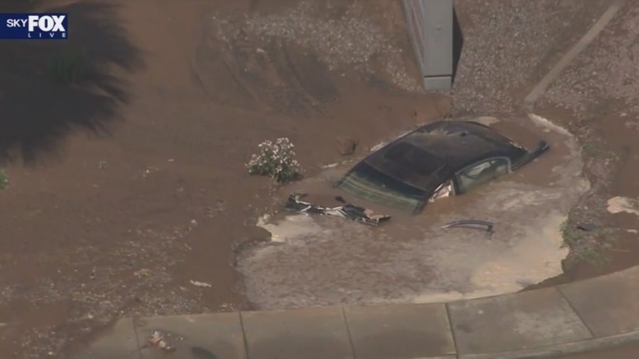 car sinking into mud desert sky mall