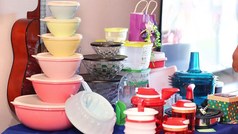 FILE - Tupperware items rest on a table during a Tupperware party in Sebastian, Florida, on Wednesday, May 18, 2022. (Stephen M. Dowell/Orlando Sentinel/Tribune News Service via Getty Images)