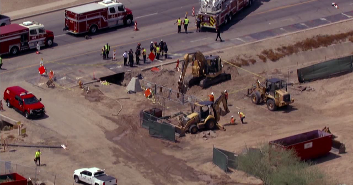 Worker rescued after falling into trench and becoming trapped in ...