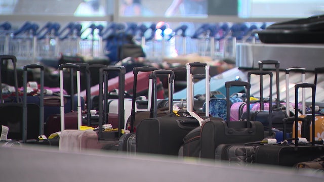 Unclaimed Delta luggage sits at Sky Harbor Airport following global tech outage