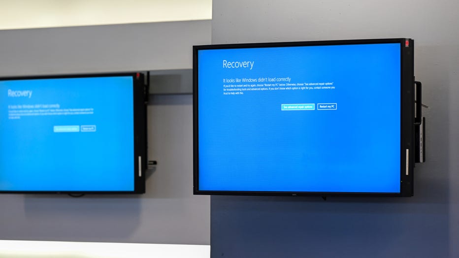 Information monitors are seen at an airport check-in counter as flights are canceled due to a global tech outage. (Photo by Tayfun Coskun/Anadolu via Getty Images)