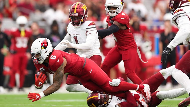 James Conner #6 of the Arizona Cardinals runs the ball during the first quarter against the Washington Commanders at State Farm Stadium on September 29, 2024 in Glendale, Arizona. (Photo by Christian Petersen/Getty Images)