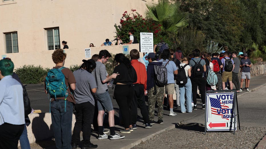 Voters wait to cast their ballots on November 8, 2022 in Tucson. (Photo by Kevin Dietsch/Getty Images)