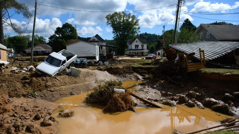 Damage and residual flooding from Mill Creek is seen in the aftermath of Hurricane Helene on September 29, 2024 in Old Fort, North Carolina. (Photo by Melissa Sue Gerrits/Getty Images)