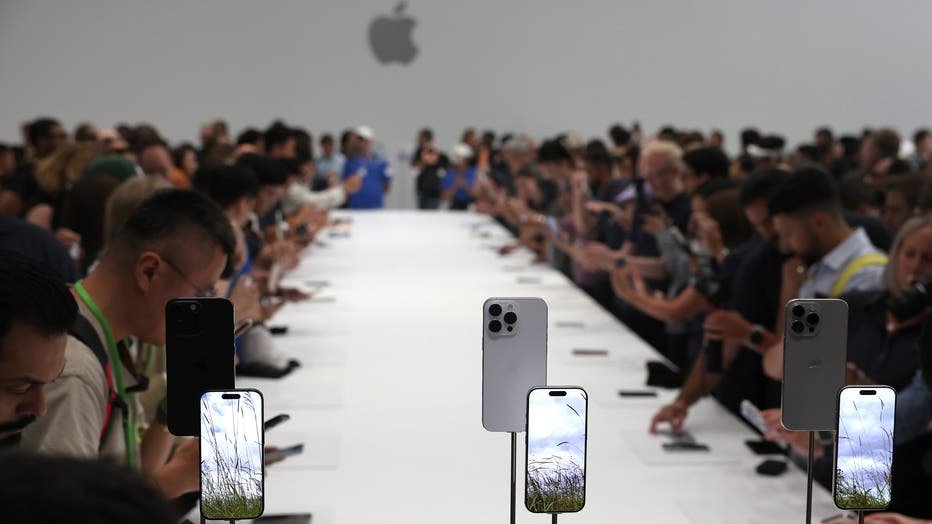 Attendees inspect the new iPhone 16 Pro and 16 Pro Max during an Apple special event at Apple headquarters on September 9, 2024 in Cupertino, California. (Photo by Justin Sullivan/Getty Images)