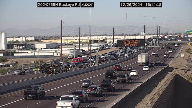Semi-truck rollover blocks lanes on Loop 202 South Mountain Freeway