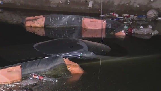 Car crashes into a canal after hitting a bicyclist in Glendale