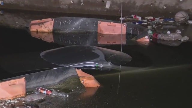 Car crashes into a canal after hitting a bicyclist in Glendale