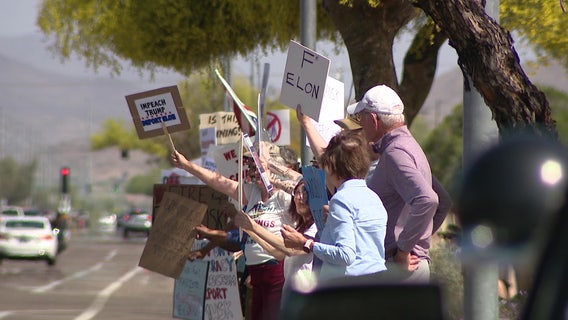 Protest against Elon Musk and DOGE seen outside of Phoenix Tesla dealership