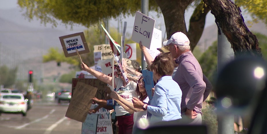 Protest against Elon Musk and DOGE seen outside of Phoenix Tesla dealership