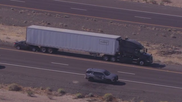 Car crushed underneath semi-truck on I-10