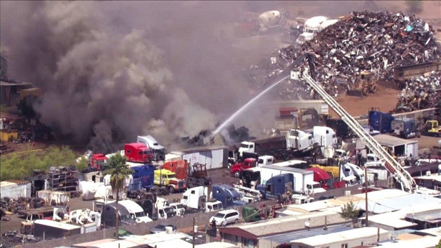 Crews battle scrapyard fire in south Phoenix