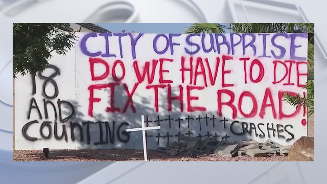 Surprise family displays sign where several drivers have crashed into their home