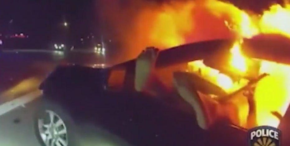Goodyear officer rescues woman from burning car