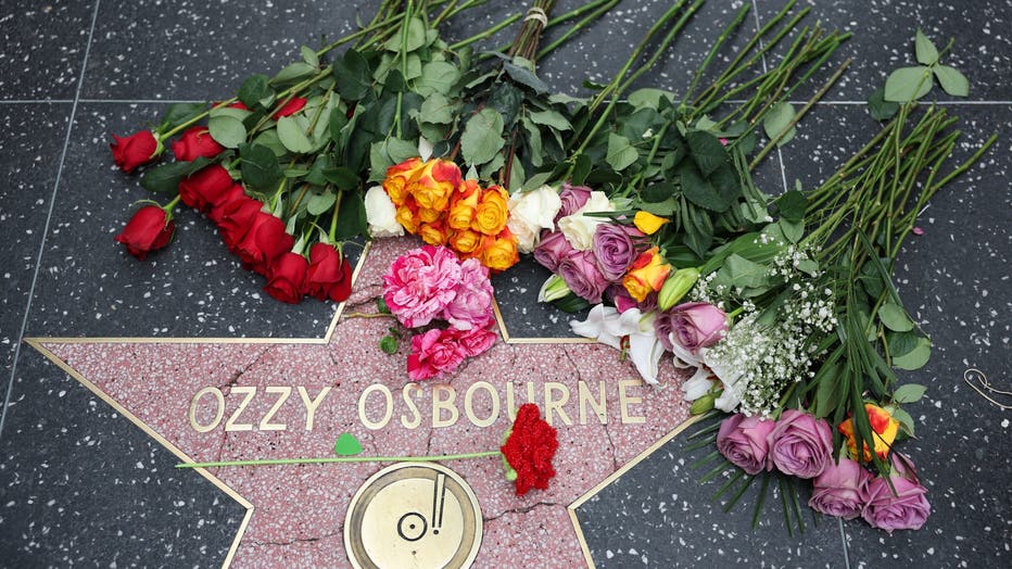 Flowers are left at Ozzy Osbourne's Star on the Hollywood Walk of Fame on July 22, 2025, in Los Angeles, following news of Osbourne's death. (Photo by PATRICK T. FALLON/AFP via Getty Images)