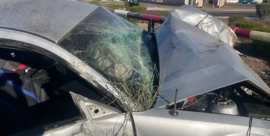 Car flips over, catches fire in Phoenix pawn shop parking lot