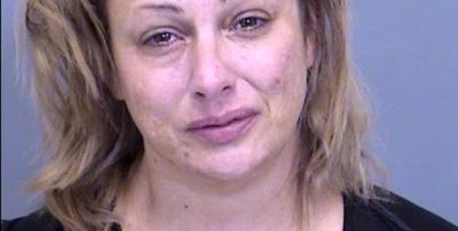 Teen dead, his mother arrested after Phoenix motel room