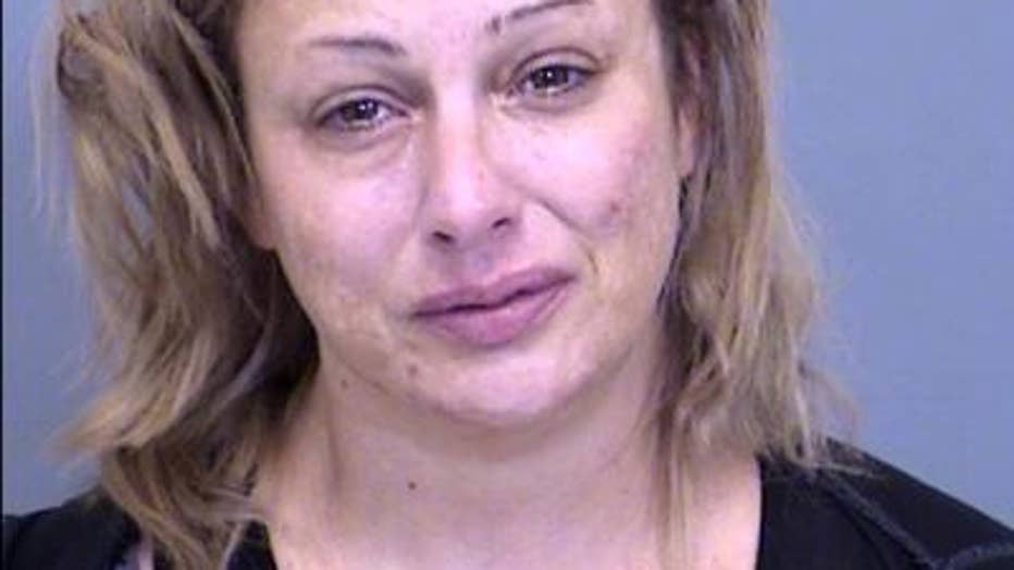 Teen dead, his mother arrested after Phoenix motel room