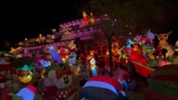 AZ home's yard filled with holiday inflatables