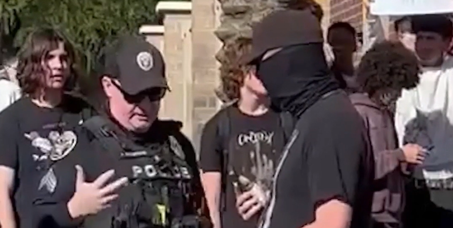 New video shows off-duty, masked Phoenix cop armed at student ICE protest