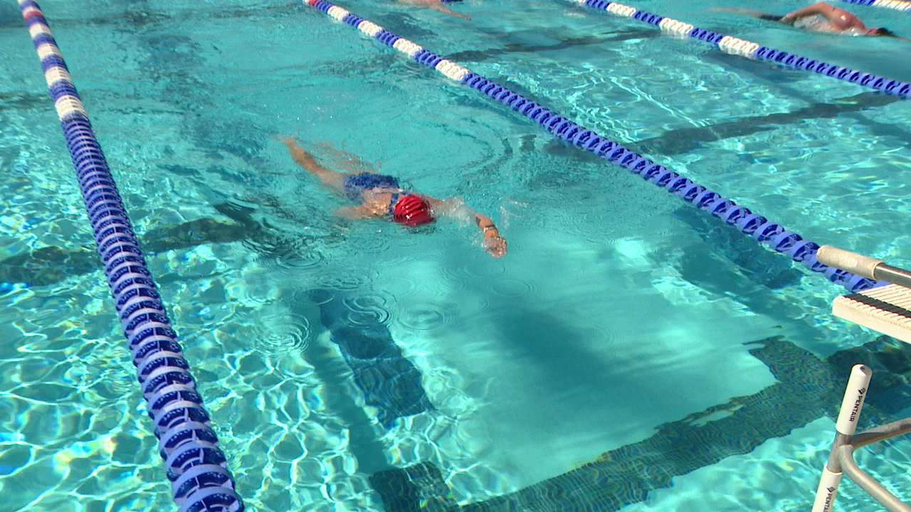 Stage 4 melanoma patient swims for cancer cure in Mesa