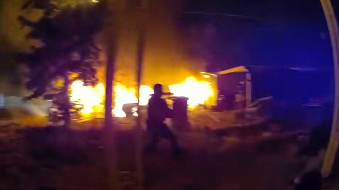 Mesa officers hospitalized after pulling 2 people from burning home
