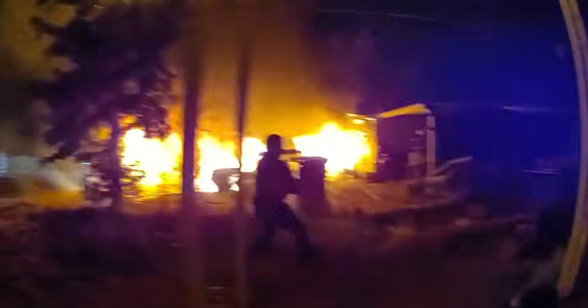 Mesa officers hospitalized after pulling 2 people from burning home
