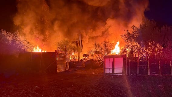 Apache Junction house fire spreads to nearby brush