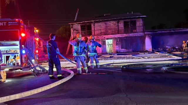Woman rescued from burning Phoenix home