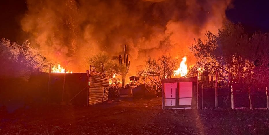 Apache Junction house fire spreads to nearby brush