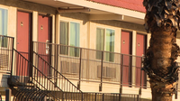 2 men accused of gunpoint robbery at Phoenix motel
