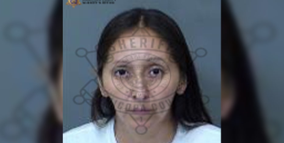 Woman accused of threatening employee while robbing Mesa bank: PD