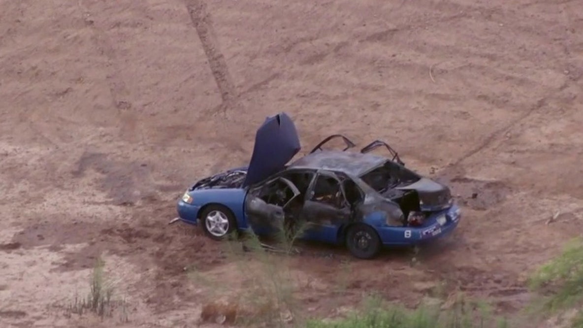 Body found inside burned car in Gilbert dirt lot
