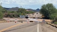 North Phoenix roads flood as morning storms swell Skunk Creek