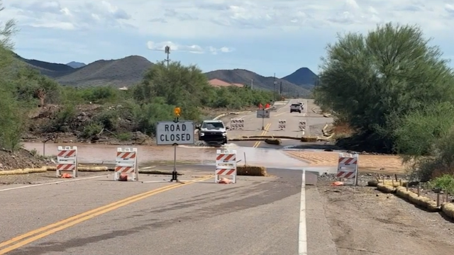North Phoenix roads flood as morning storms swell Skunk Creek