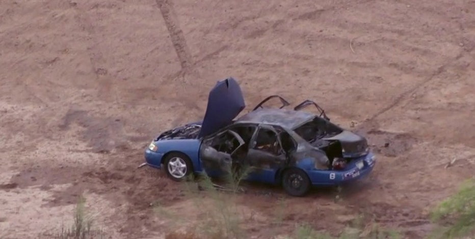 Body found inside burned car in Gilbert dirt lot