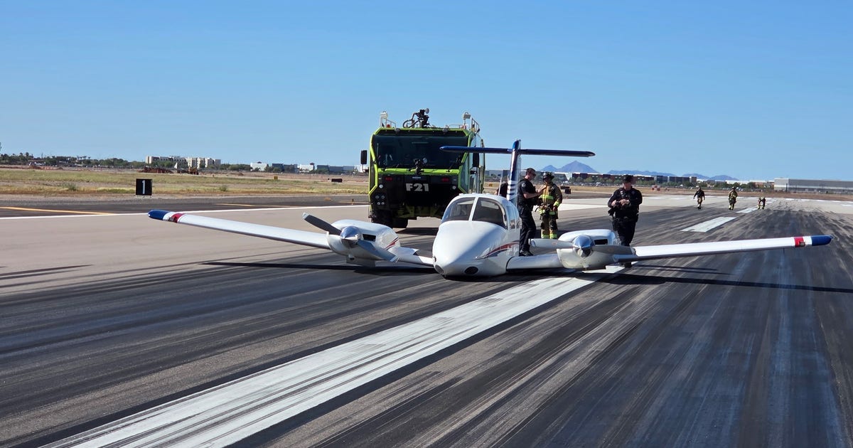 Piper Seminole lands gear‑up at Mesa Gateway Airport, occupants unharmed