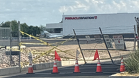 Street racing suspect rams Scottsdale Airport gate, hits small airplane, police say