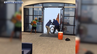Phoenix bank employees help street vendor from severe storm in viral video