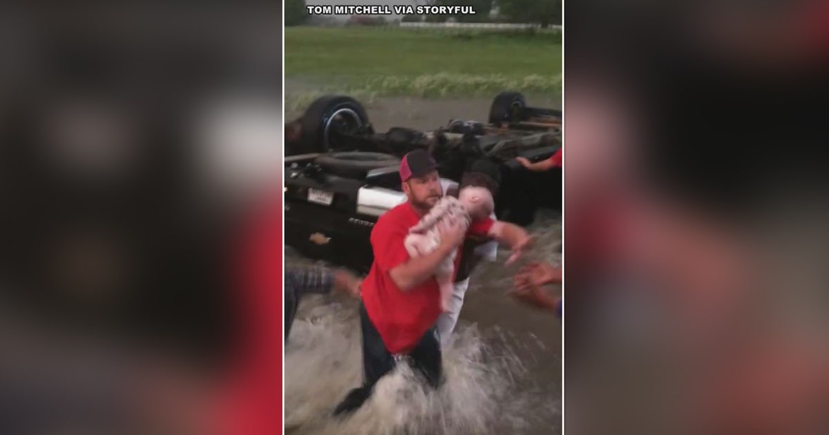 WATCH: Good Samaritans rescue babies from overturned car in rushing ...