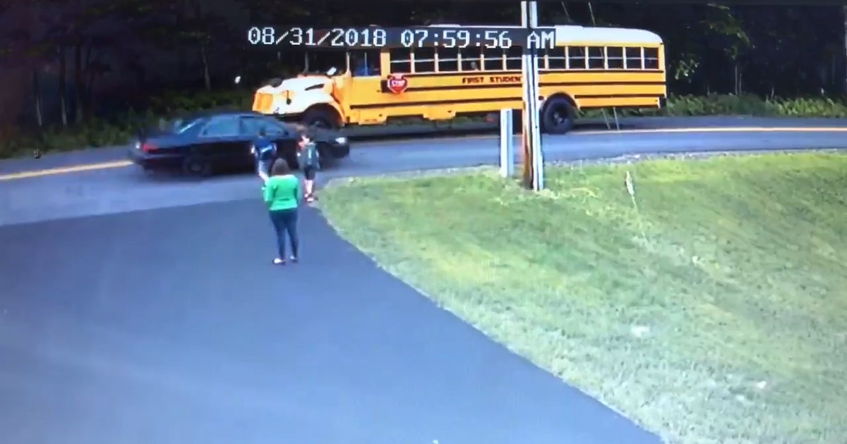 Young boy nearly hit by car while crossing road for school bus | FOX 13 ...