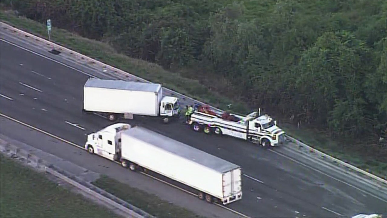Overturned mail truck backs up SB I75