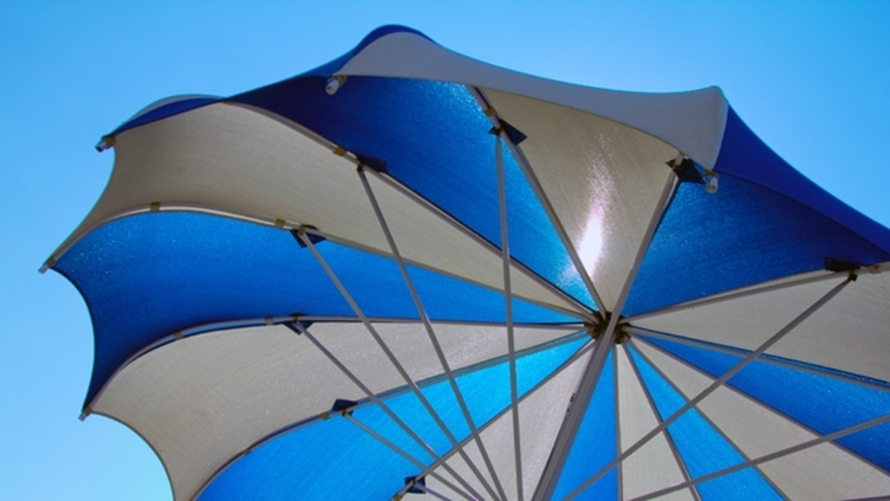Woman dies after being impaled by flying beach umbrella at Virginia Beach