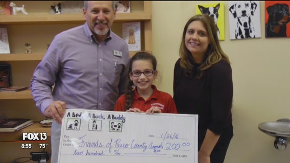 Young author delivers proceeds from books to animal shelters