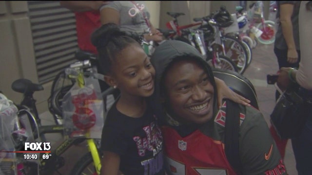 Bucs play Santa for 60 Bay Area families