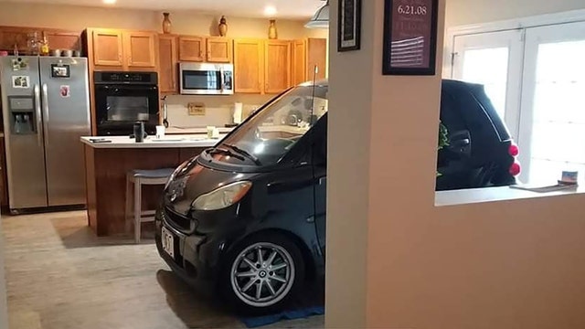 Florida man parks Smart car in kitchen so it won't blow away