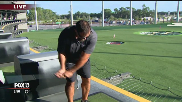 Charley hangs with Mike Alstott at Topgolf
