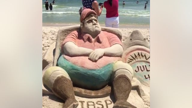 PHOTOS: Sand sculpture recreates now infamous Gov. Christie beach photos